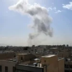 Smoke rises over Tehran as Iran vows homeland defense after US-Israeli strikes.