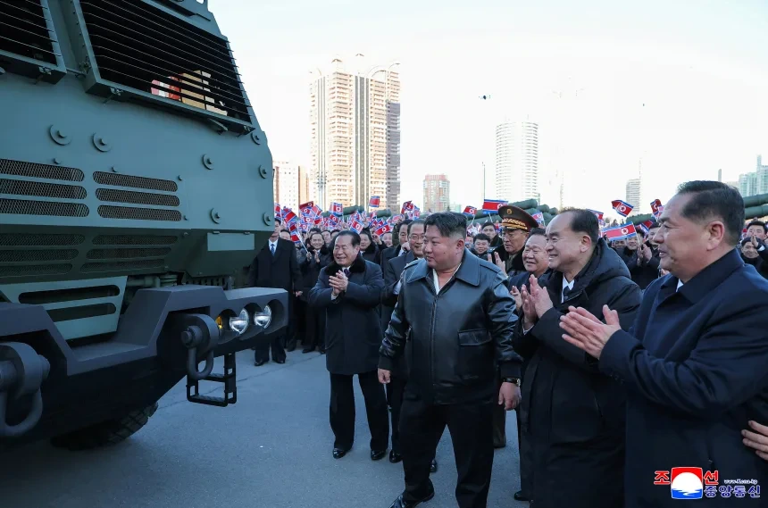 Kim Jong Un drives missile launcher during a nuclear weapons display in Pyongyang.