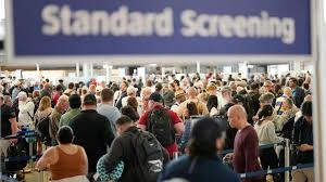 Long queues at an airport terminal as the US Senate votes to fund most of Homeland Security to end the crisis.